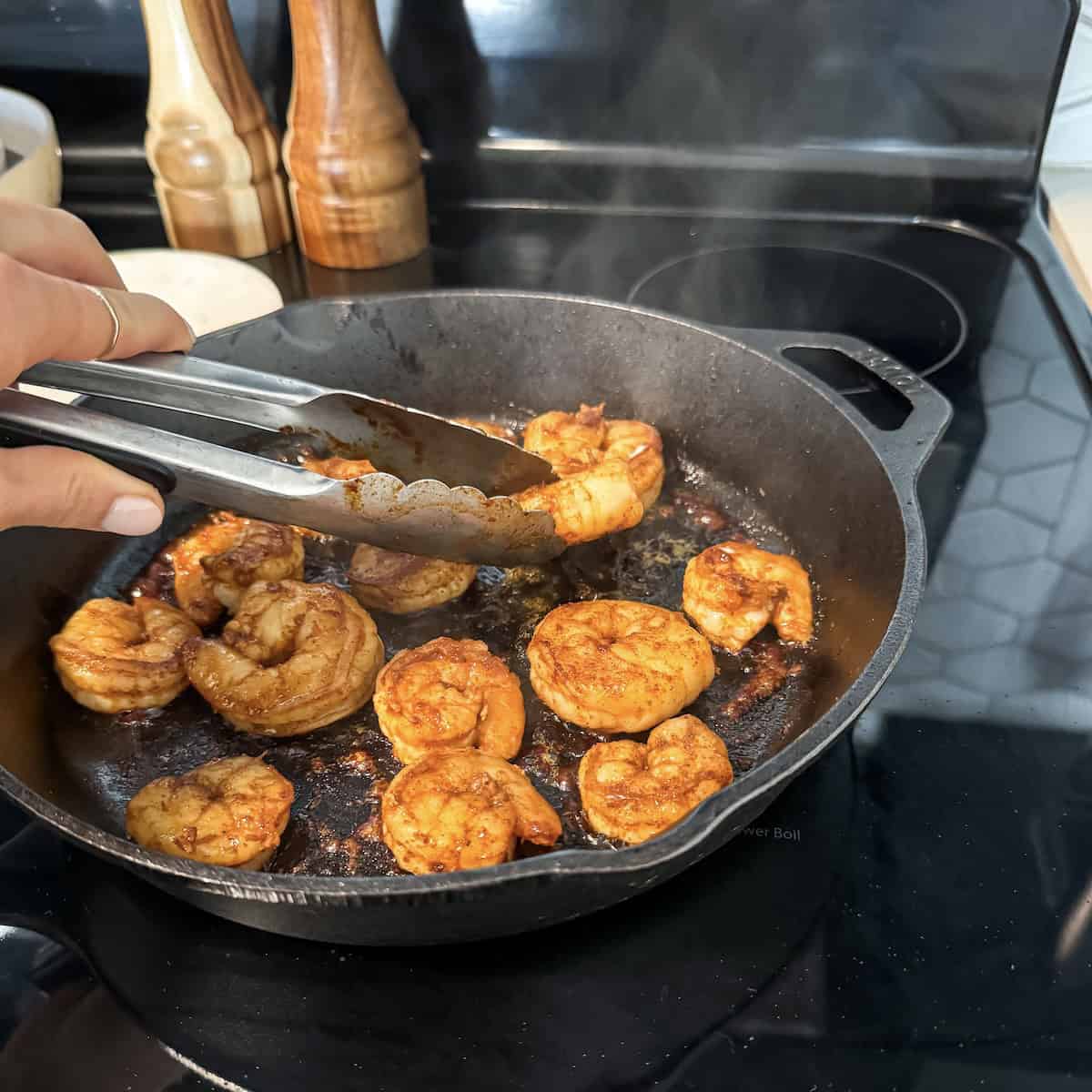 chili lime shrimp being cooked in a cast iron.