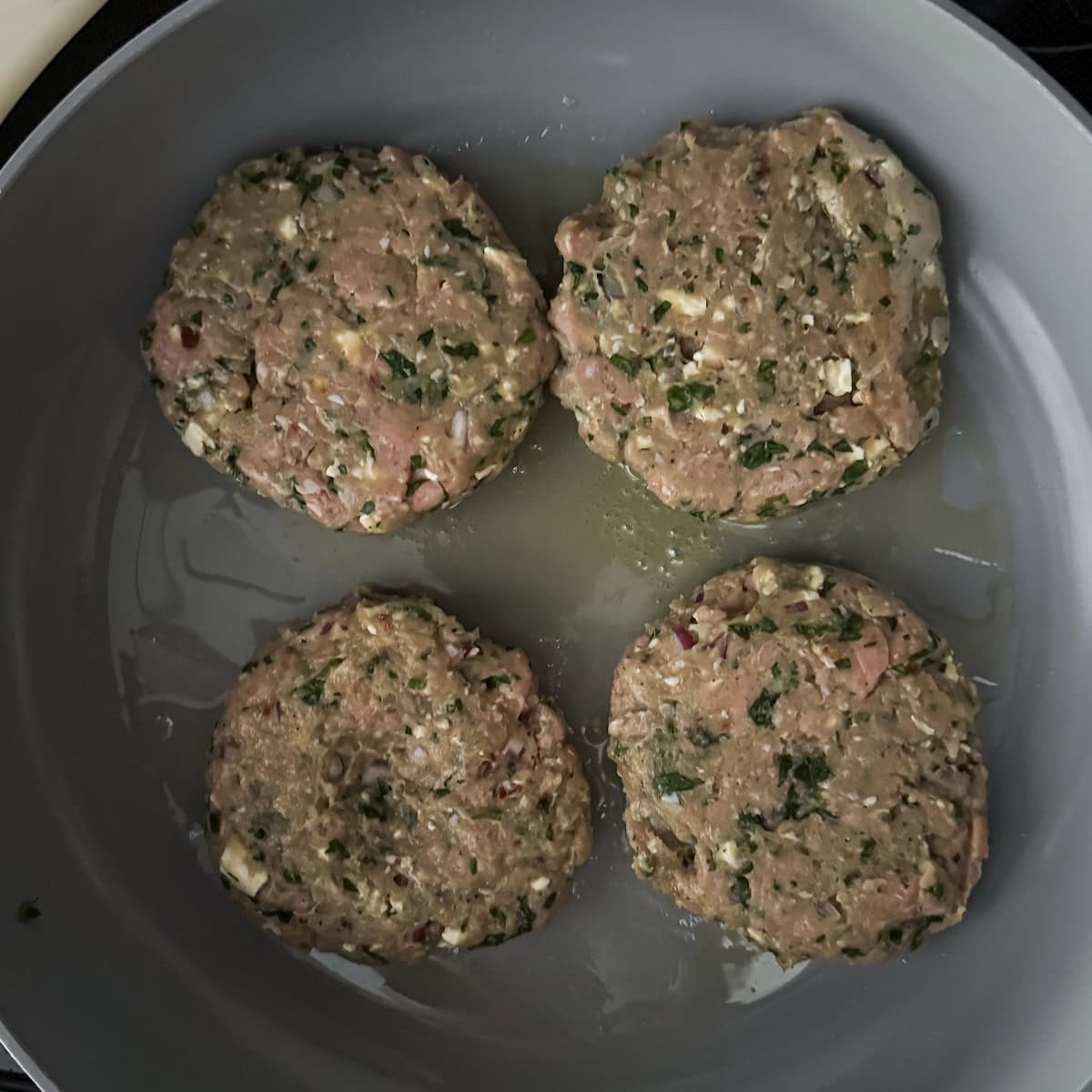 turkey burger feta spinach in a skillet.