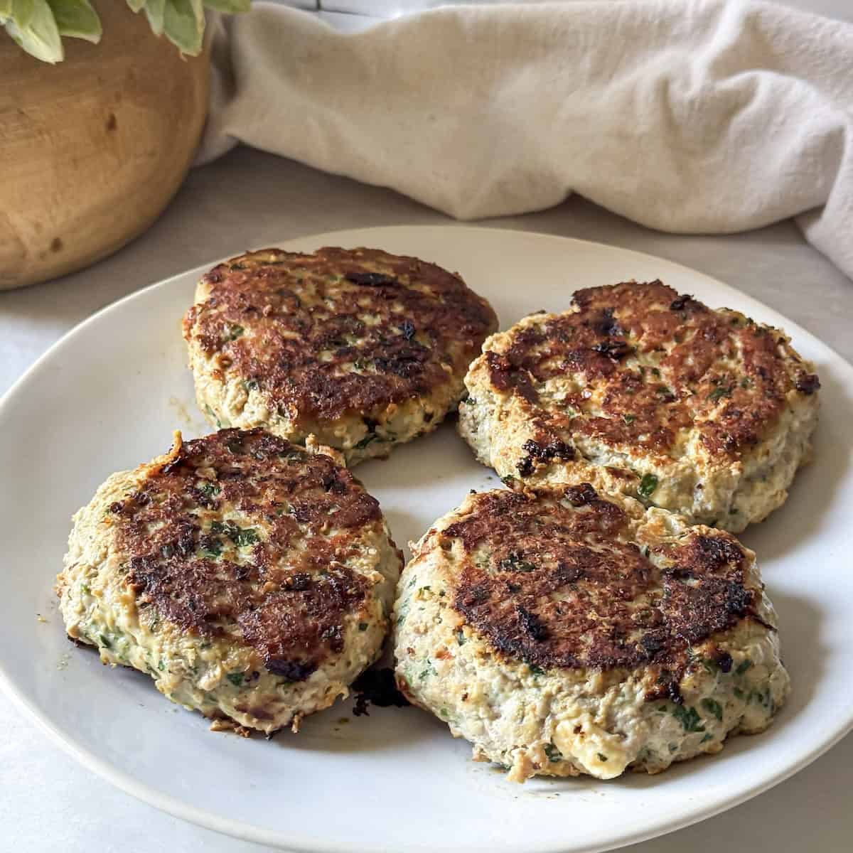 turkey burger feta spinach on a plate.