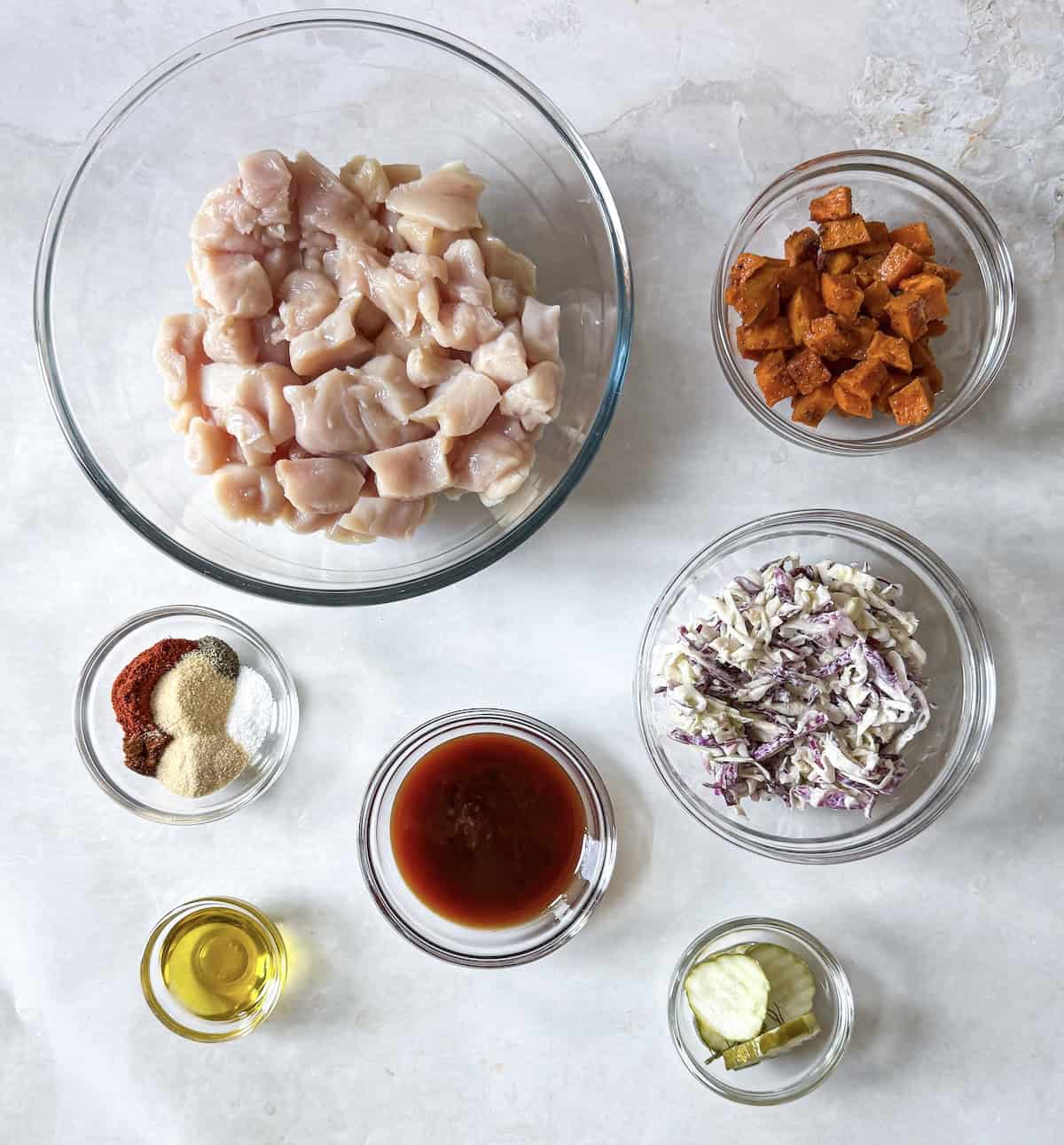 bbq chicken bowl ingredients on a table.