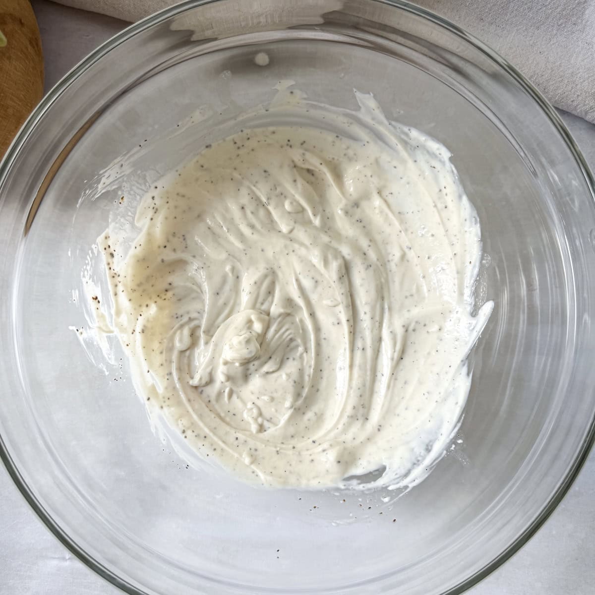 coleslaw dressing made with greek yogurt in a bowl.