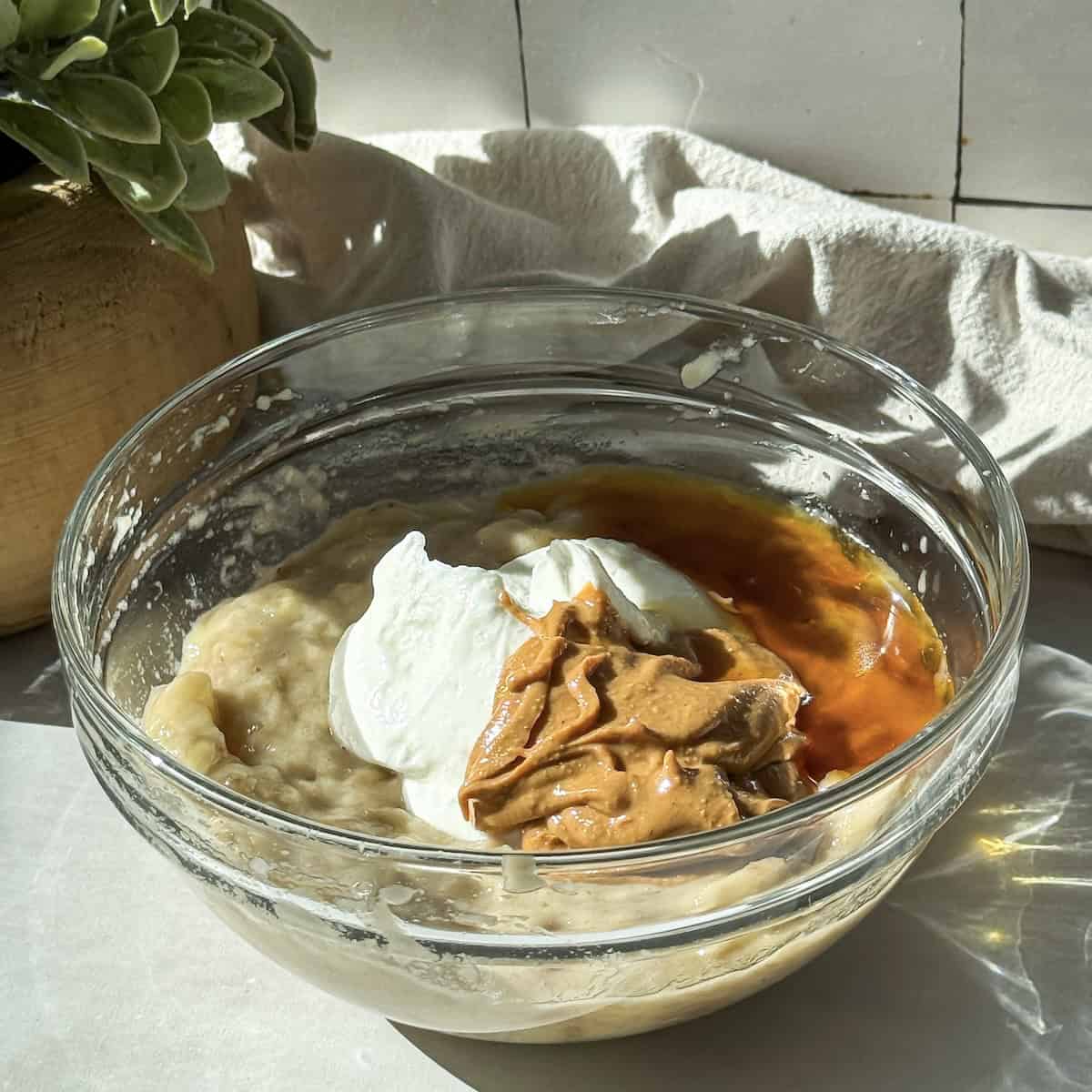 ingredients for banana yogurt bites in a bowl.