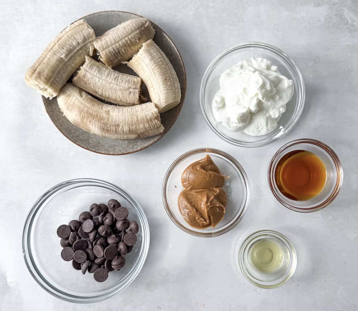 ingredients for banana yogurt bites on a table.