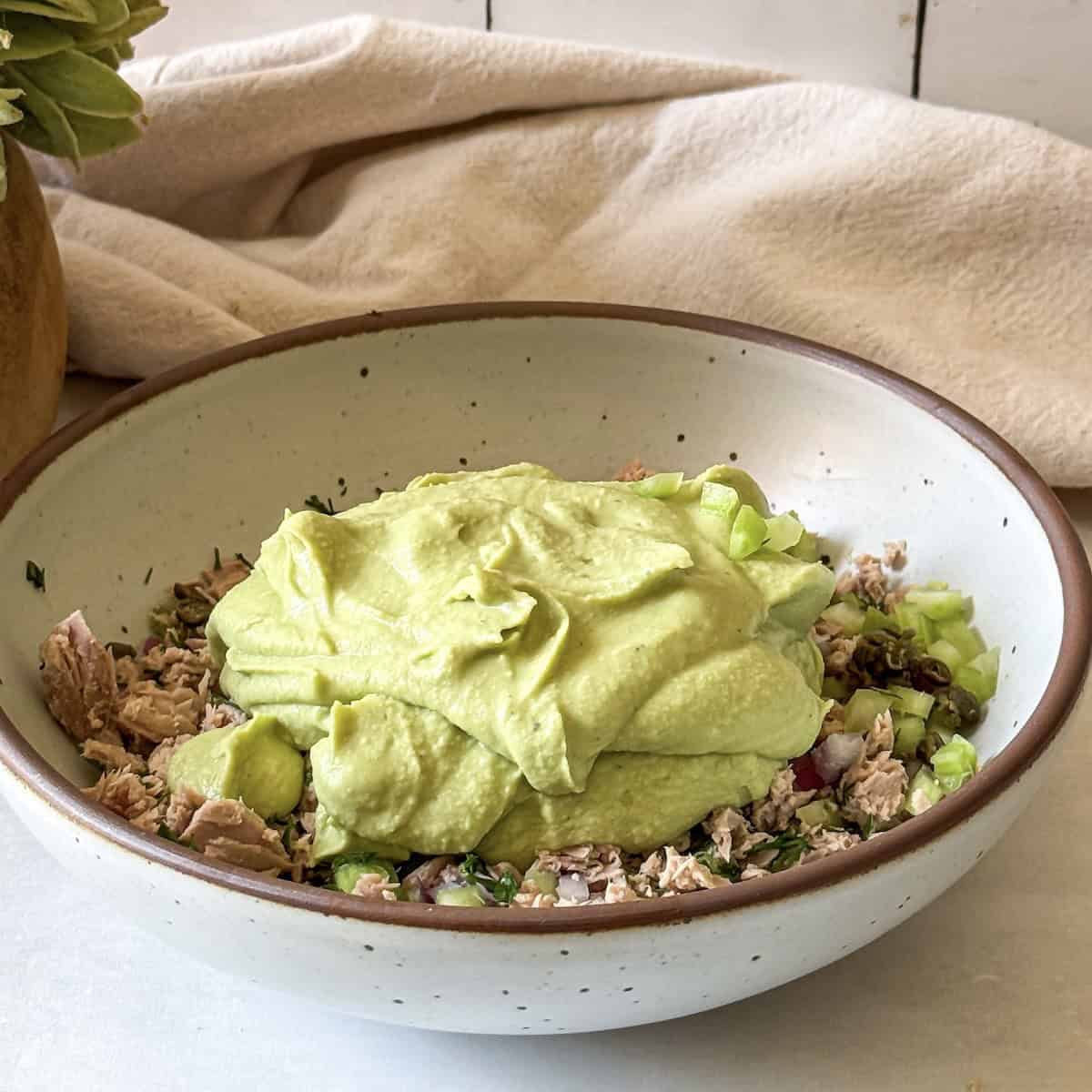 blended white bean mixture on top of tuna, red onion, and celery.