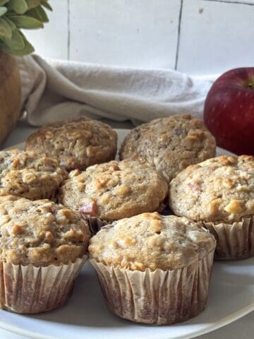 A plate of apple oat muffins right after coming out of the oven.