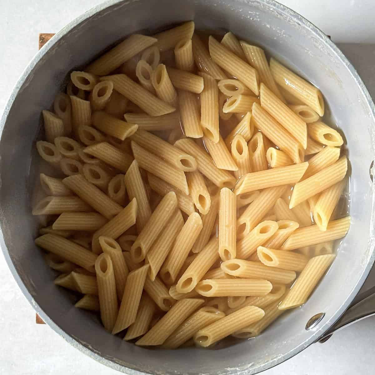 Cooked pasta in a saucepan.