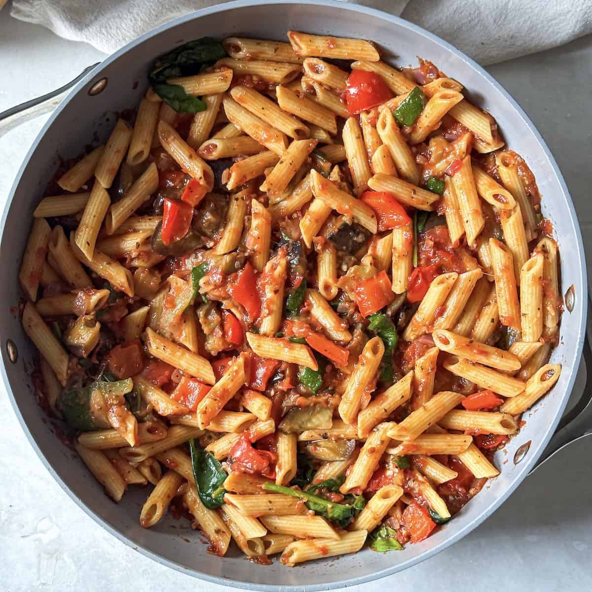 roasted vegetable pasta in a skillet right after being cooked.