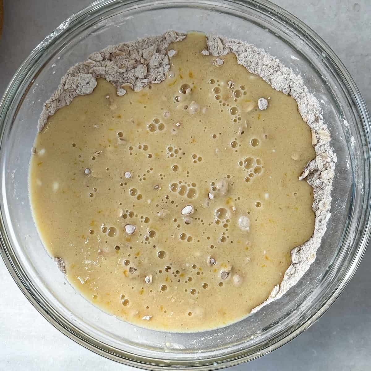 wet ingredients added to the dry in a glass bowl just before being mixed together.